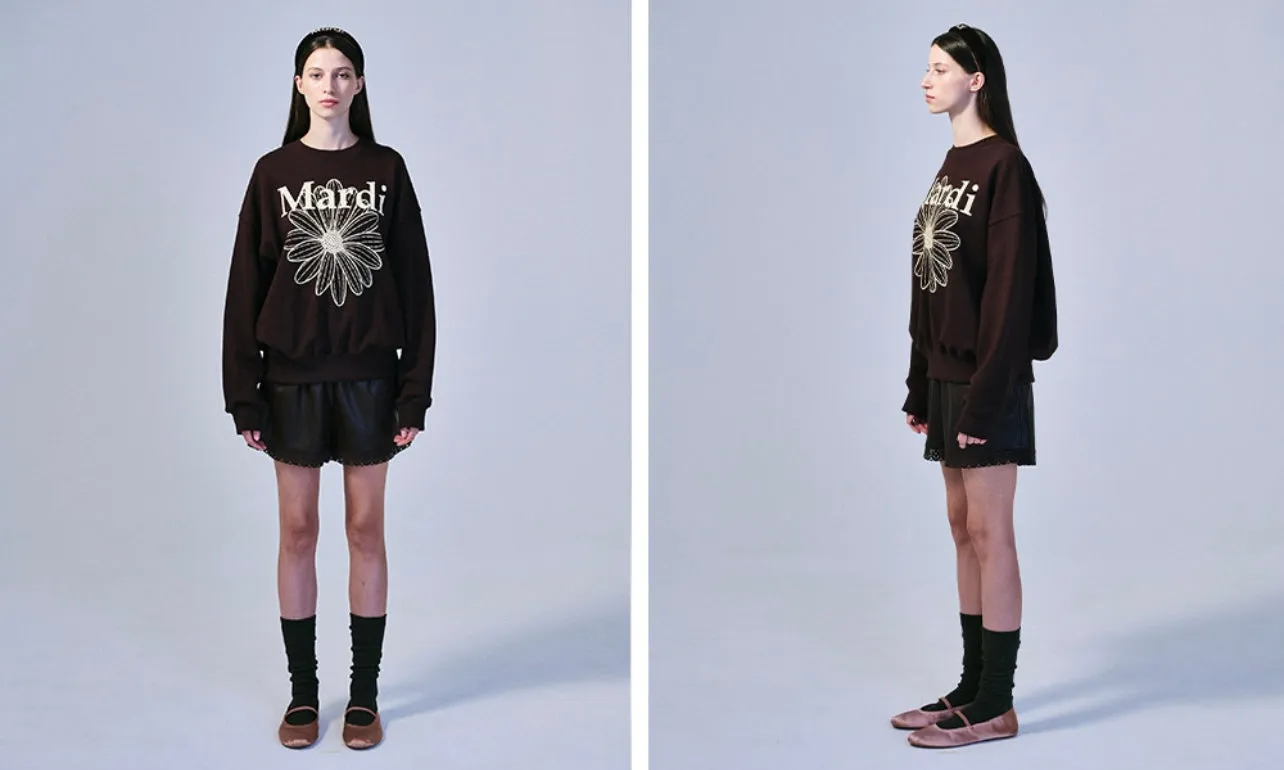 Brown cream sweatshirt with flower design.