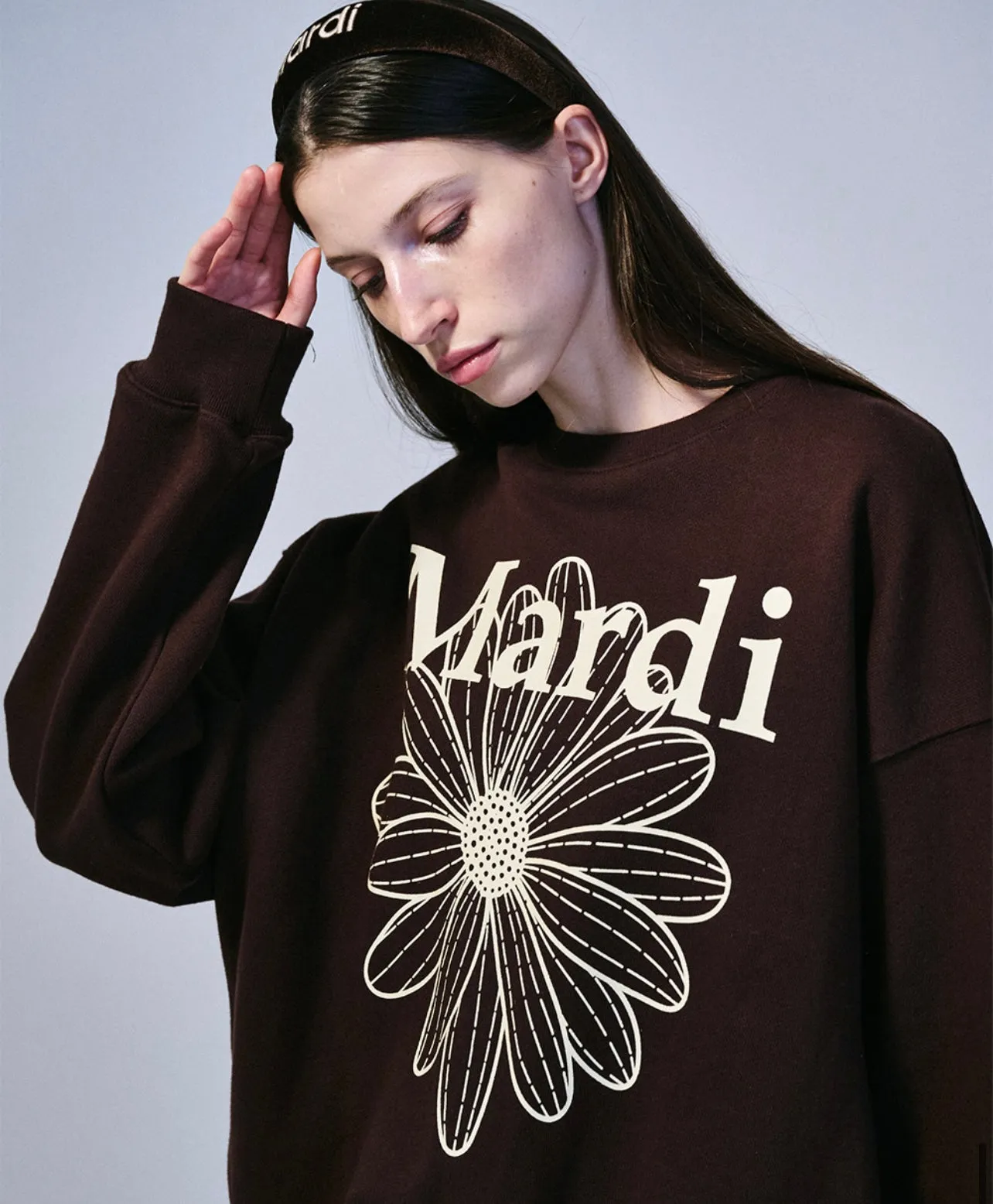 Brown cream sweatshirt with flower design.