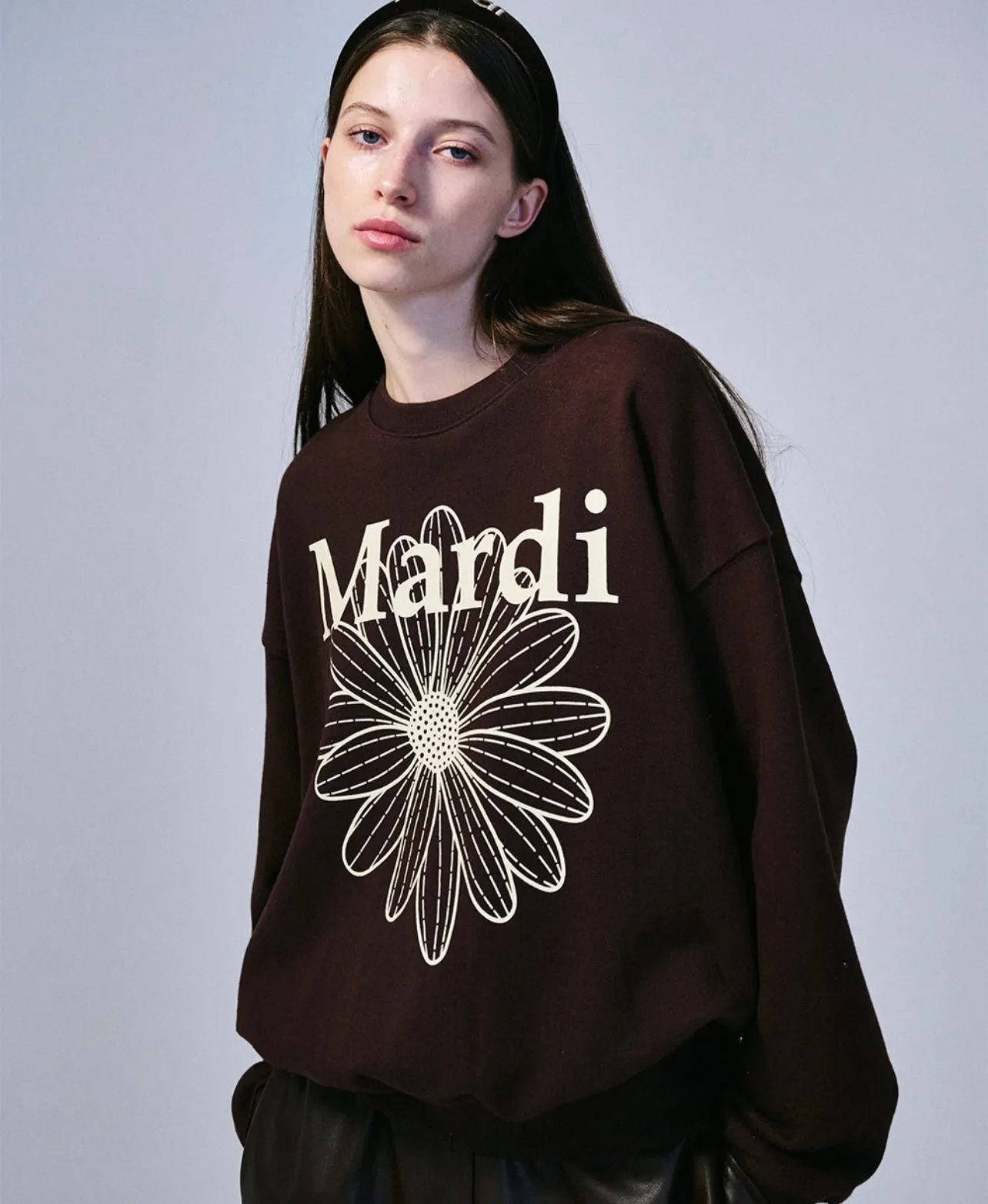 Brown cream sweatshirt with flower design.