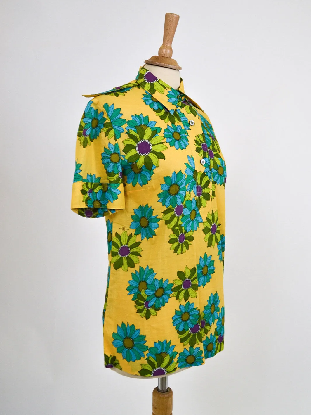 Gio Caré vintage 1970s yellow floral shirt with three buttons.